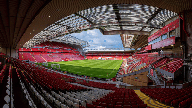 Anfield football stadium in Liverpool displaying sponsors ads