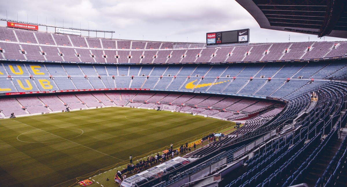 empty soccer stadium with brand logos on the seats; media value equivalency concept